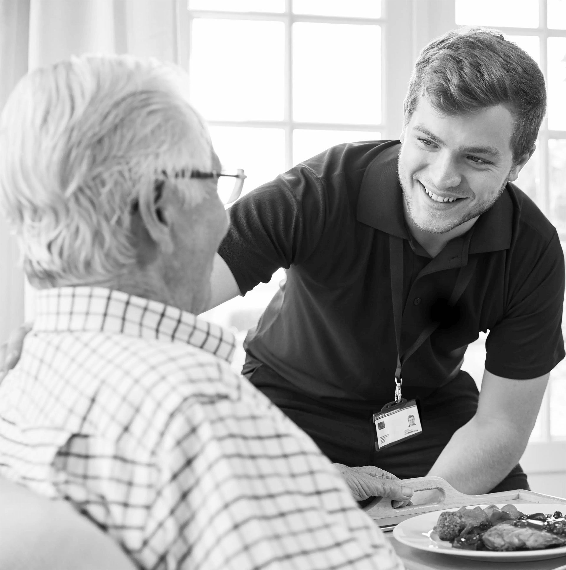 Care worker serving food